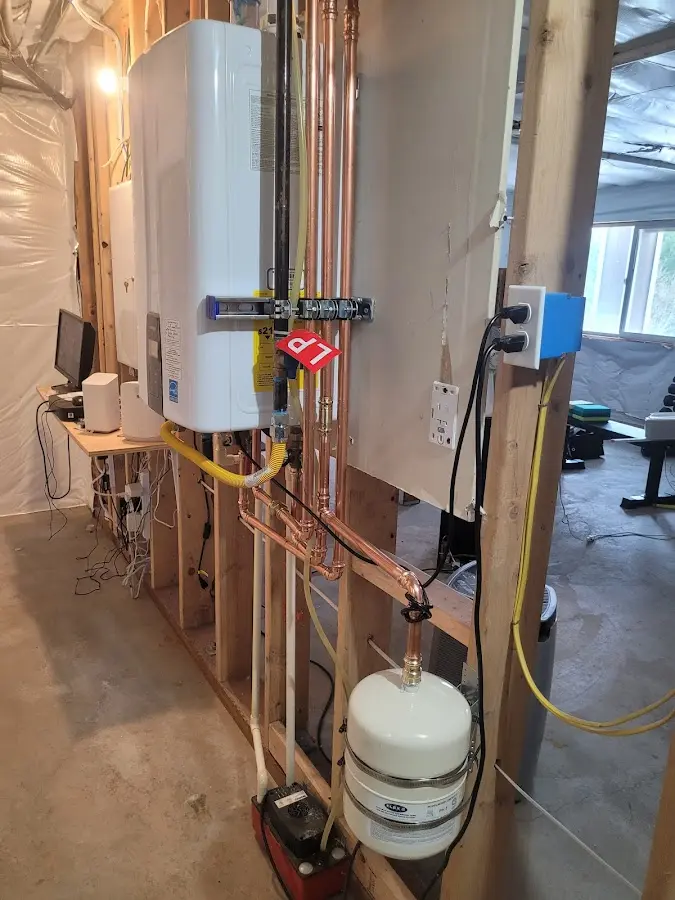 Licensed plumber repairing a kitchen sink in Tillamook